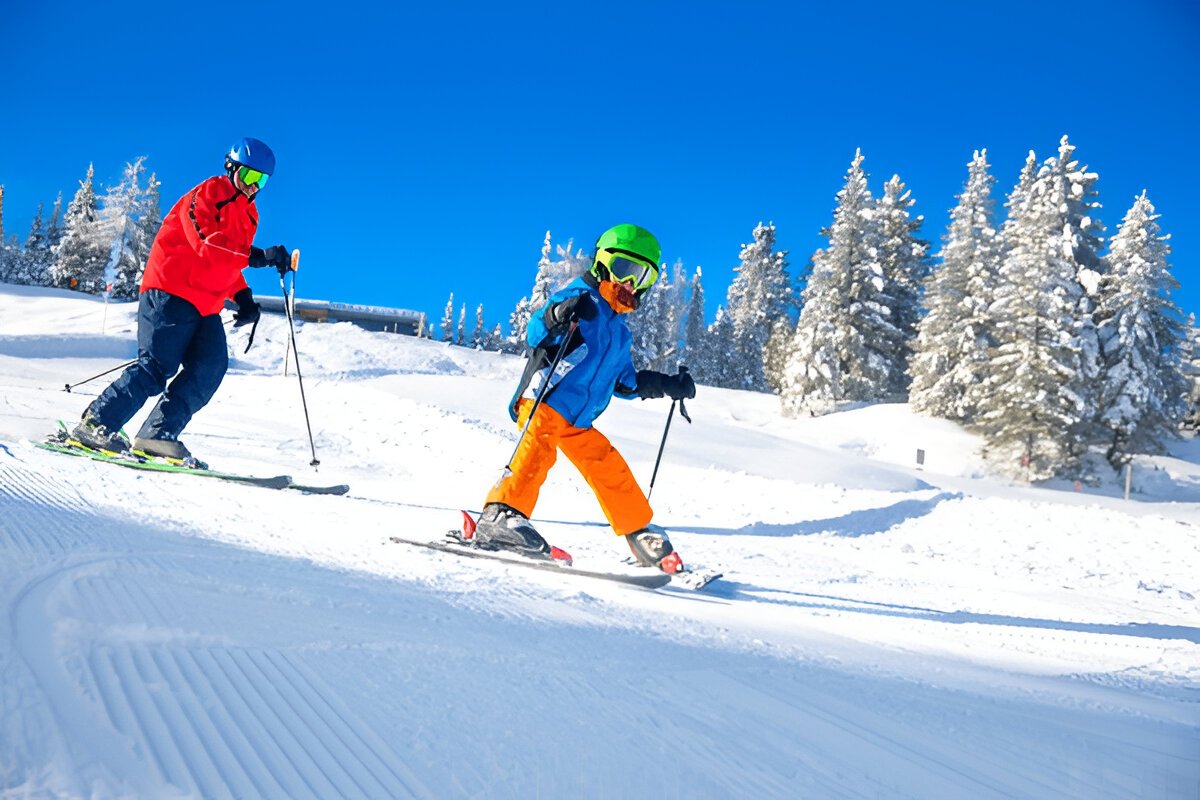 A mother teaching her kid how to ski in the Pocono Mountains region