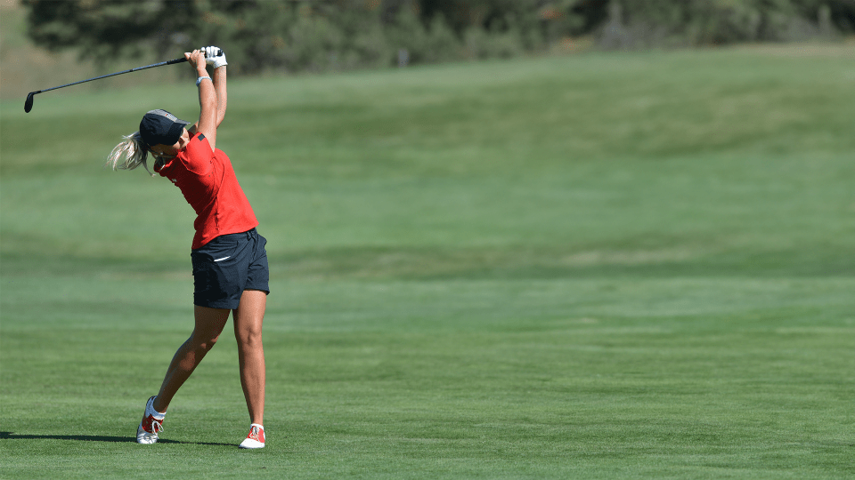 A young girl playing golf near the Delaware Water Gap concentrates on her shot.